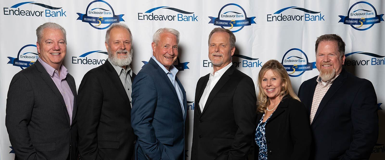 leadership team in front of endeavor background