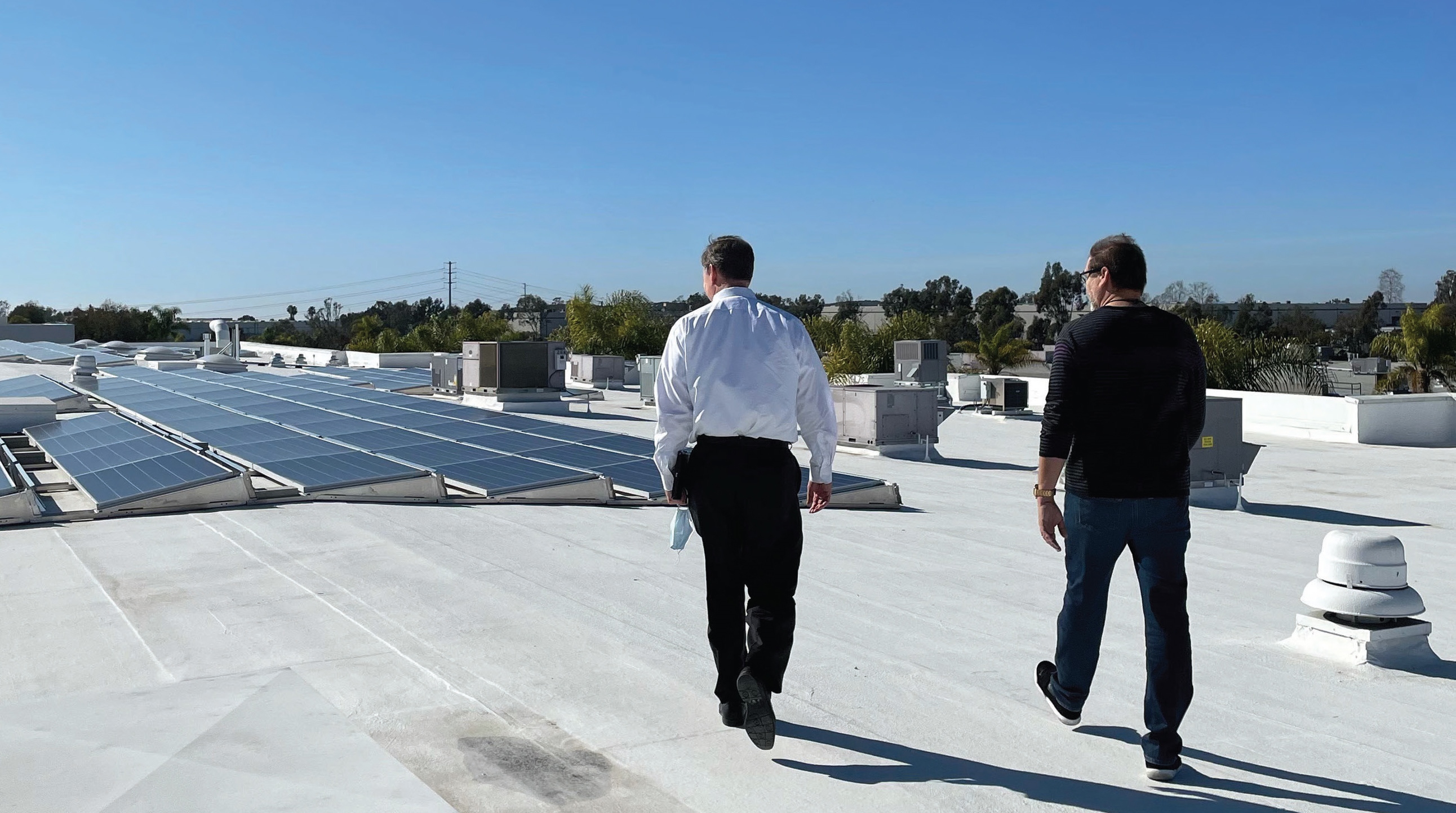 Two men walking on building